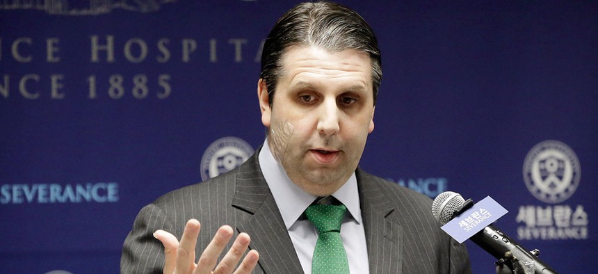 Mark Lippert addresses the media in March after the attack.
