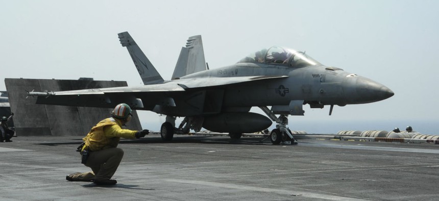 Lt. Cmdr. Craig Ryan launches an F/A-18F Super Hornet from the deck of the USS Roosevelt, which is supporting operations against ISIS. 
