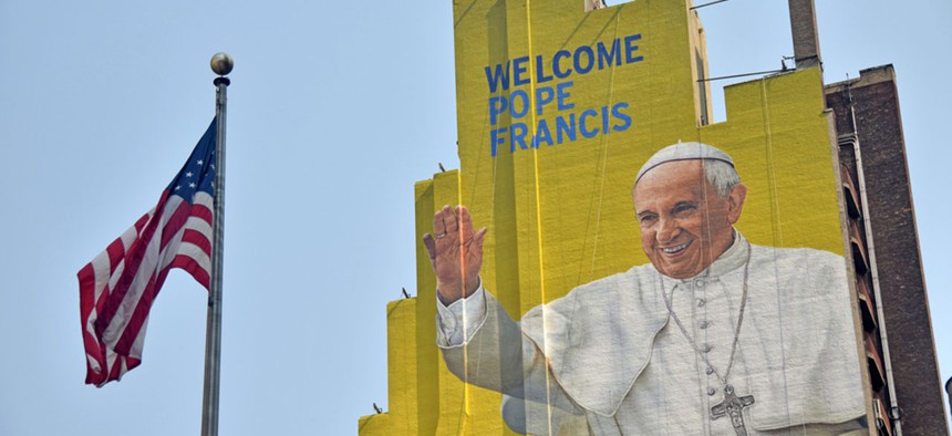 A building in New York shows a painting of Pope Francis in anticipation of his visit to the United States.