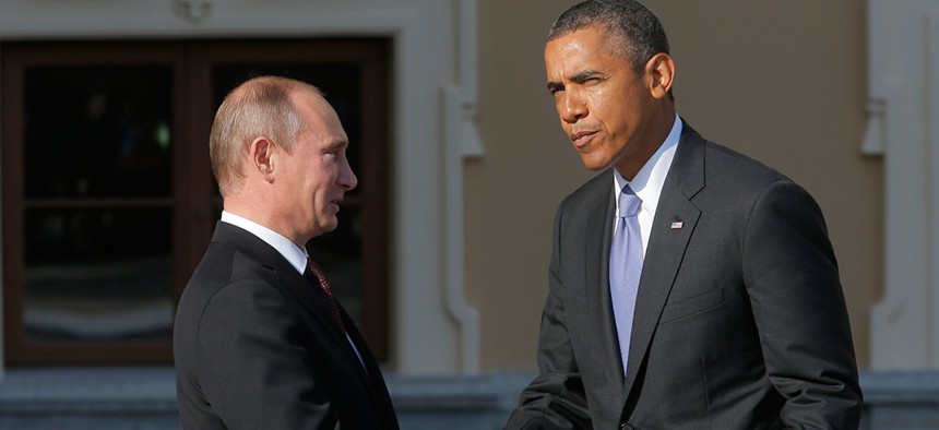 Putin and Obama greet each other in Russia in 2013. 
