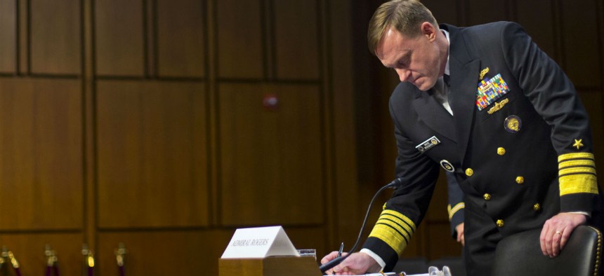 NSA Director Adm. Michael Rogers prepares to testify before the Senate Intelligence Committee.