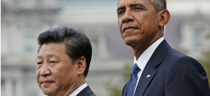 Obama and Chinese President Xi Jinping review the troops during an arrival ceremony Friday. 