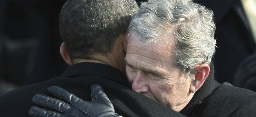Former president George W. Bush hugs President Obama after his January 2009 swearing in. 