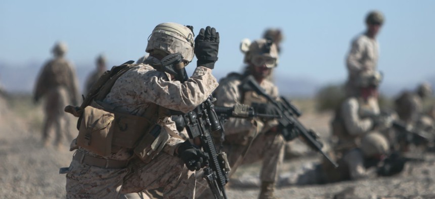 Marines set up perimeter security during a fast rope exercise at Auxiliary Airfield 2, Yuma, Ariz.