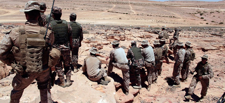 U.S. Marines observe training maneuvers in Jordan in 2013.