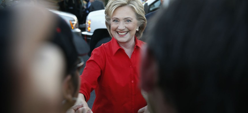 Clinton shakes hands during a rally in Las Vegas Monday. 