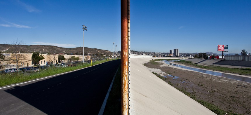 A portion of a border fence near San Ysidro, California is seen in 2012. The United States is on the left with Mexico 