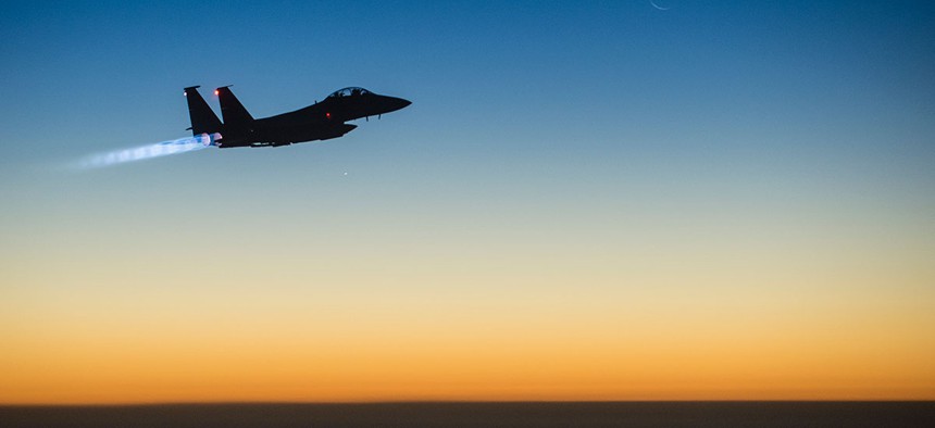 An Air Force F-15E Strike Eagle flies over northern Iraq in 2014 after conducting airstrikes in Syria.