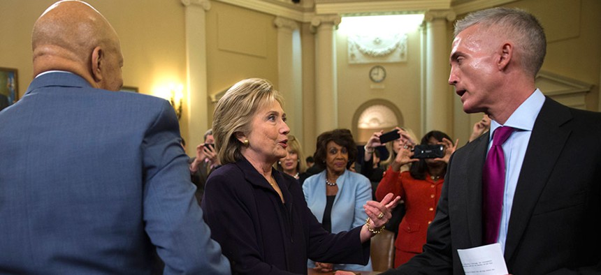 Hillary Clinton shakes hands with House Select Committee on Benghazi Chairman Rep. Trey Gowdy at the conclusion of Thursday's hearing as Rep. Elijah Cummings looks on. 