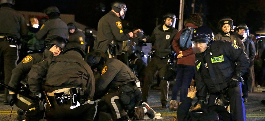 Police in Ferguson, Missouri take protestors into custody in November, 2014.