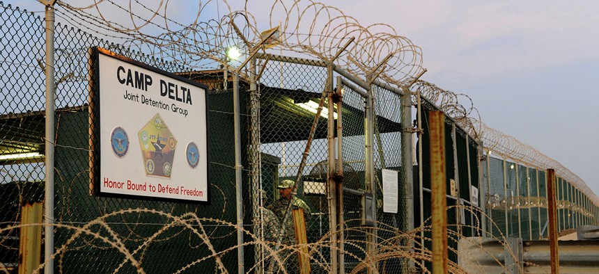Soldiers assigned to the 115th Military Police Company of the Rhode Island Army National Guard stand guard at a sally port inside Camp Delta at Joint Task Force Guantanamo in 2010