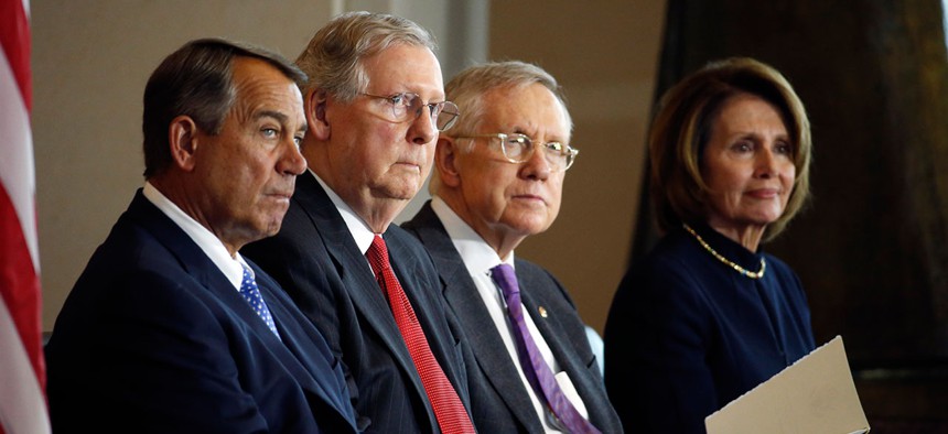 Rep. John Boehner, left, of Ohio, Senate Majority Leader Mitch McConnell of Ky., Senate Minority Leader Harry Reid, of Nev., and House Minority Leader Nancy Pelosi of Calif., sit during an event this week in Washington