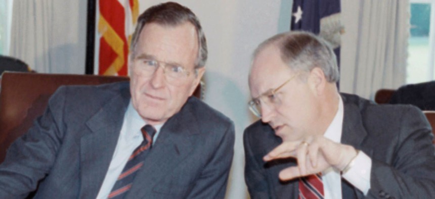 Bush and Cheney confer before a cabinet meeting in 1991.