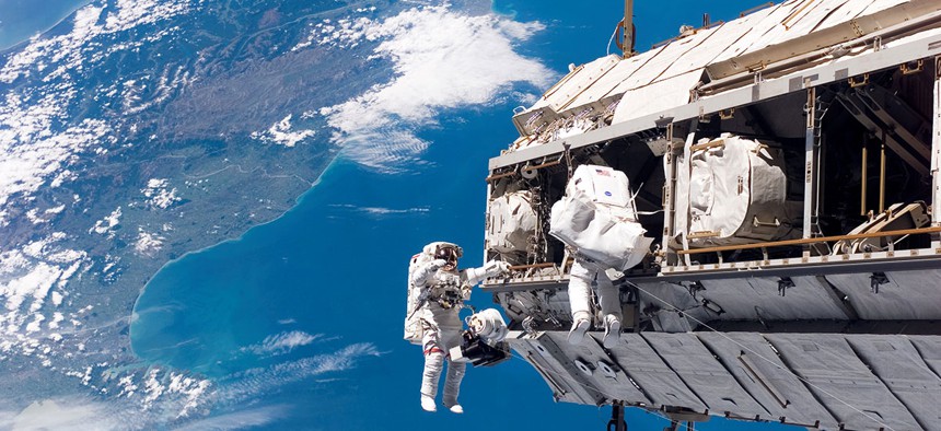 NASA and ESA astronauts conduct a spacewalk in 2006.