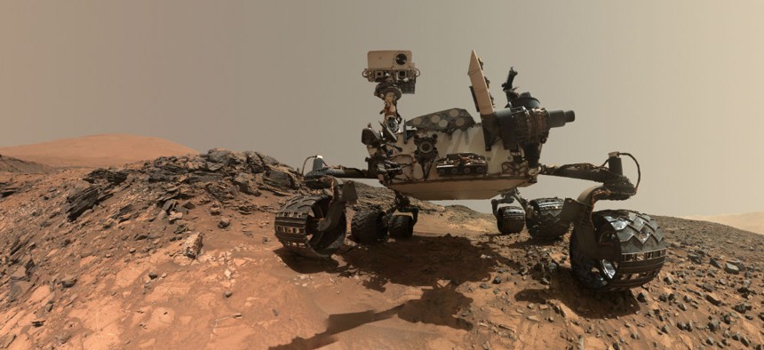 NASA's Curiosity Mars rover near a rock target on lower Mount Sharp.
