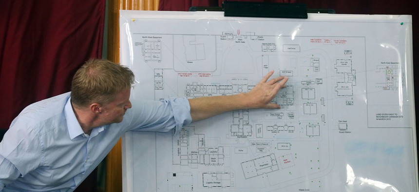 Doctors Without Borders director Christopher Stokes shows a map of their building in Kunduz city, during a press conference at their office in October.