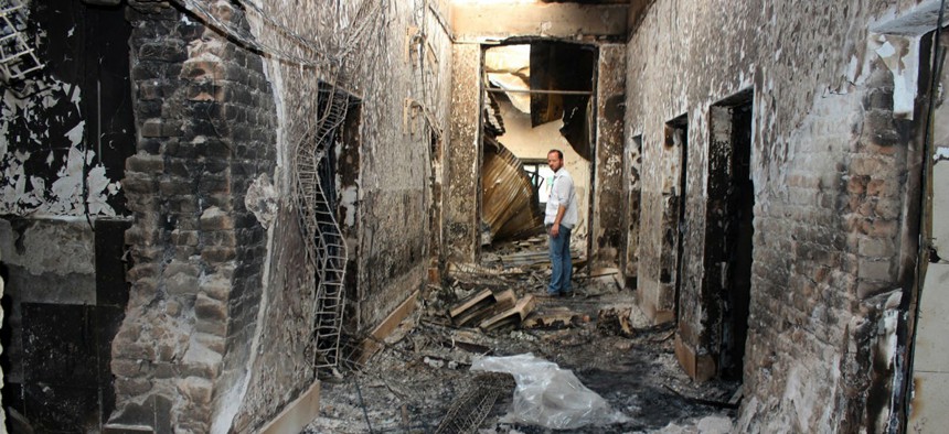 An employee of Doctors Without Borders stands inside the charred remains of their hospital after it was hit by a U.S. airstrike in Kunduz, Afghanistan. 