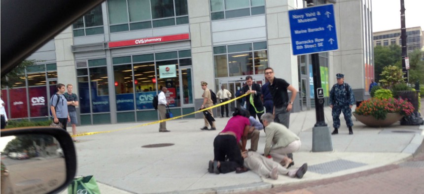 A victim of the September 2013 Navy Yard shootings receives medical attention.