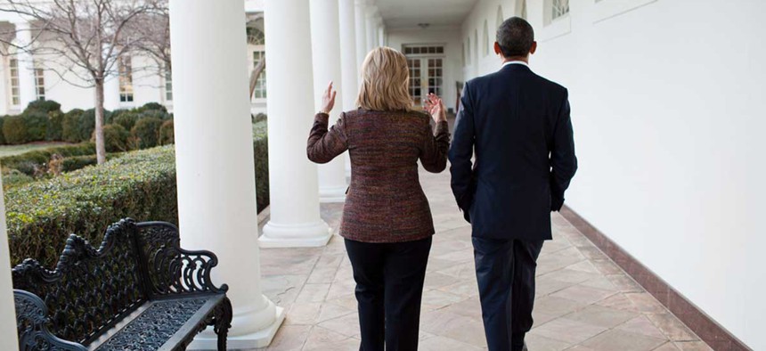 Barack Obama walks along the Colonnade of the White House with Hillary Clinton in 2011.