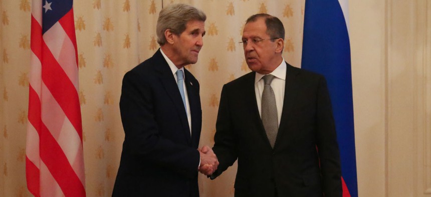 Kerry and Lavrov shake hands before their meeting. 