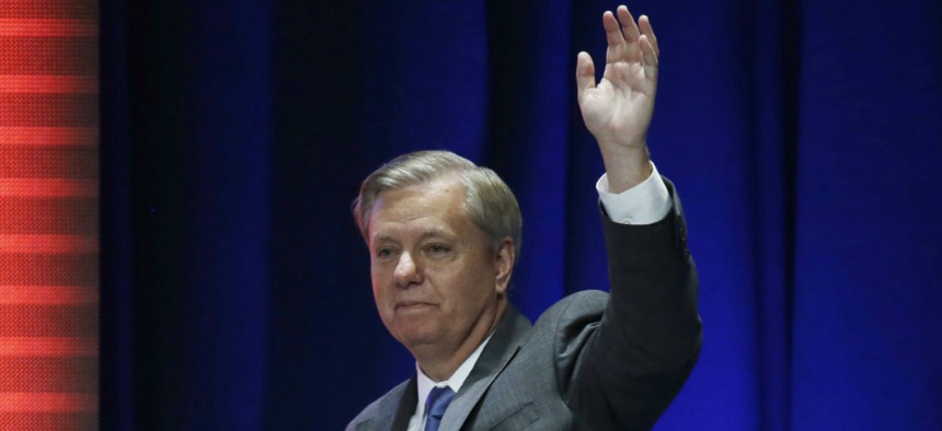 Graham waves after addressing a summit in Orlando, Fla., in November. 