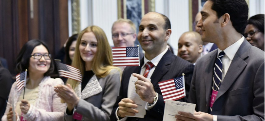 Immigrants take the Oath of Allegiance at a naturalization ceremony in Washington in October. 