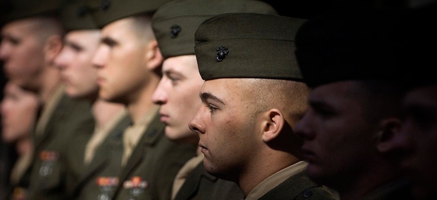 Marines stand at parade rest during a Navy Cross ceremony in 2009.