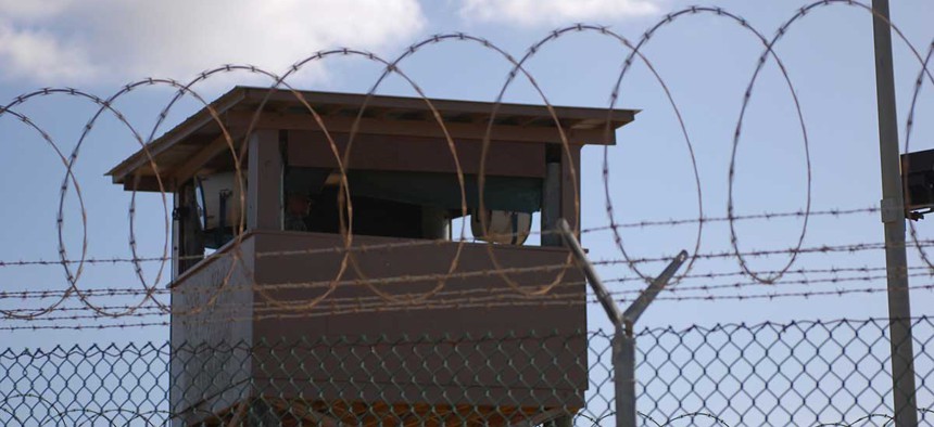 A soldier stands guard in a tower at Camp Delta at Joint Task Force Guantanamo Bay in 2009.