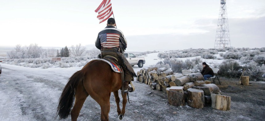 A supporter of the group occupying the Malheur National Wildlife Refuge in Oregon rides his horse at the refuge Friday. 