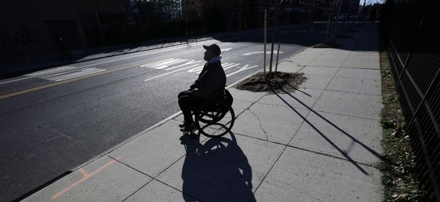 Paralyzed Army veteran Gene Laureano sits in his wheelchair Dec. 16, 2015, in Bronx, N.Y.
