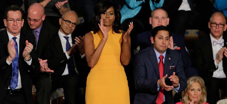 Michelle Obama and her guests applaud Tuesday during the speech.