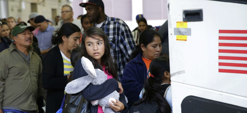 Immigrants from El Salvador and Guatemala who entered the United States illegally board a bus after they were released from a family detention center in San Antonio, Texas. 