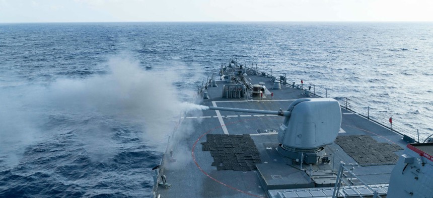The USS Curtis Wilbur (DDG 54) conducts a live fire gunnery exercise. 