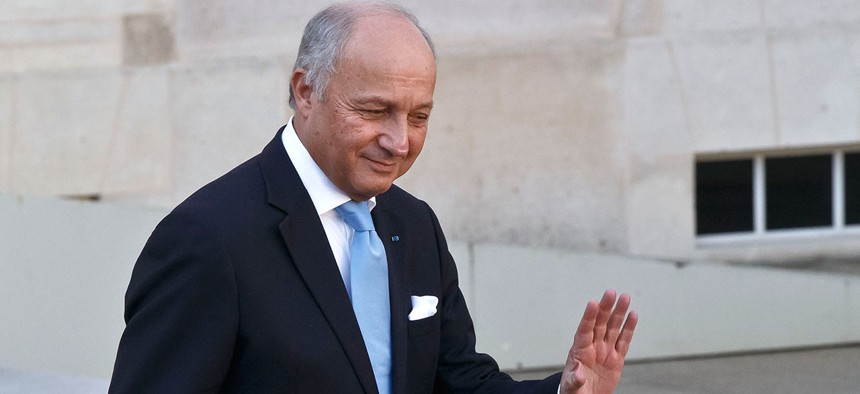 French Foreign Minister Laurent Fabius leaves the weekly cabinet meeting at the Elysee Palace Wednesday.