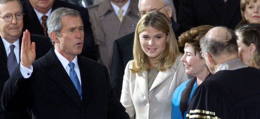 George W. Bush takes the oath of office in January 2001. Clinton staffers reportedly removed the "W" keys from White House keyboards before leaving. 
