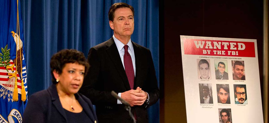 U.S. Attorney General Loretta Lynch, left, and FBI Director James Comey announce the indictments of seven Iranian hackers.