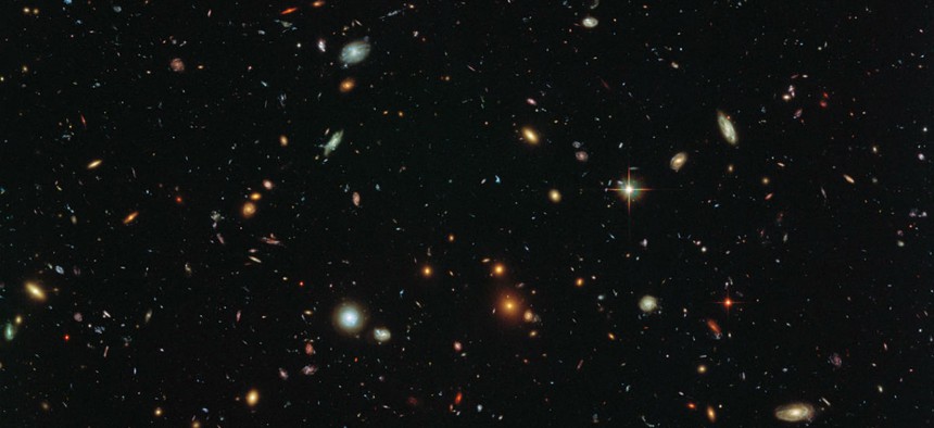 This image by the Hubble Space Telescope reveals thousands of colorful galaxies swimming in the inky blackness of space. 