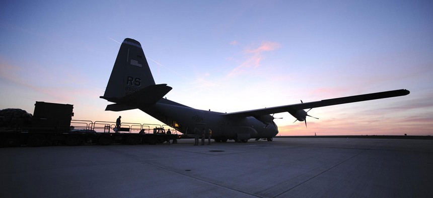 A C-130J Super Hercules is loaded before Joint Task Force Odyssey Dawn in 2011.
