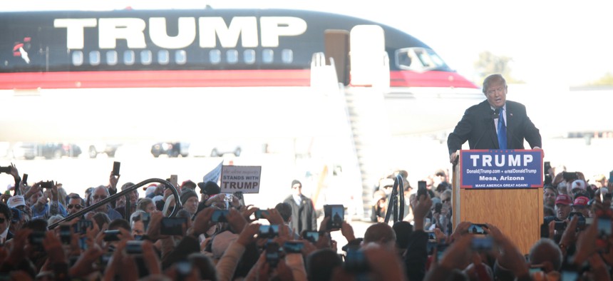 Trump speaks to supporters in Arizona in front of his jet in December. 