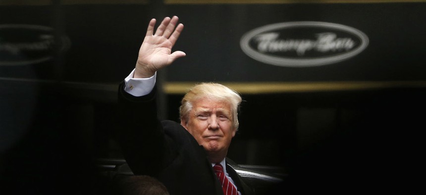 Republican presidential candidate Donald Trump acknowledges supporters while leaving Trump Tower in New York April 9.