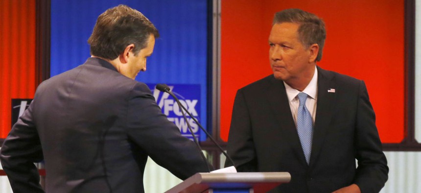 Republican presidential candidates Ted Cruz (left) and John Kasich shake hands after a debate March 3. 
