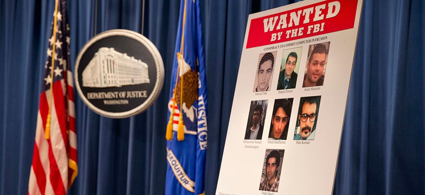 A poster lists Iranians who are wanted by the FBI for computer hacking.