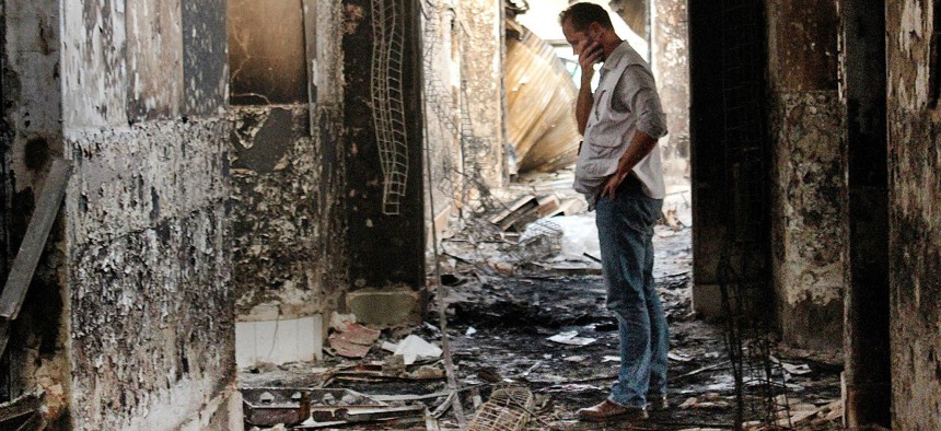 A Doctors Without Borders employee walks inside the remains of the organization's hospital after a U.S. airstrike in Kunduz, Afghanistan.