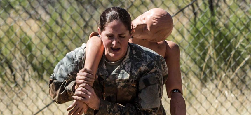 Sgt. 1st Class Kristina Martinelli evacuates a casualty at the obstacle course in 2015.