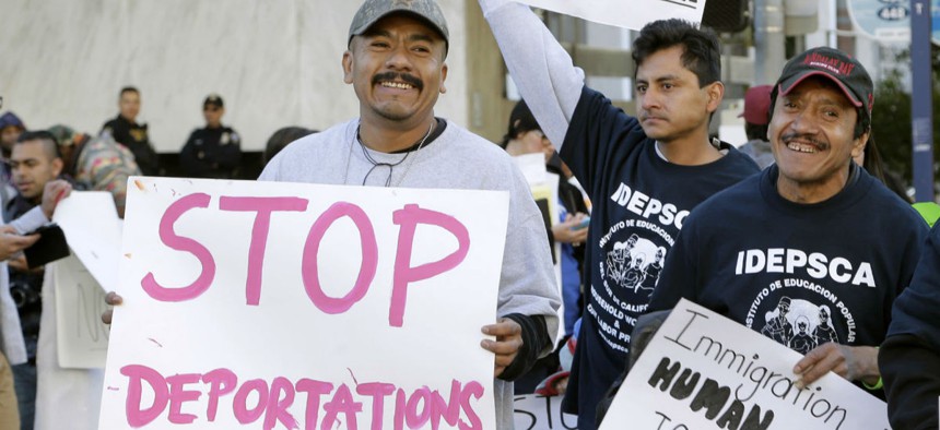 Immigration activists rally against ICE raids near the downtown Los Angeles Federal Building in January. 