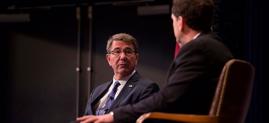  Carter participates in a moderated discussion with U.S. Naval War College Dean of Academics Phil Haun Wednesday.