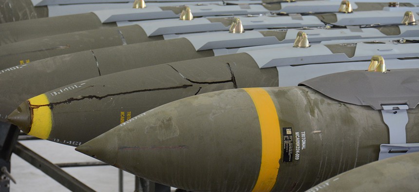 A dozen 2,000-pound joint direct attack munitions sit inside a warehouse at Al Udeid Air Base, Qatar, in December.