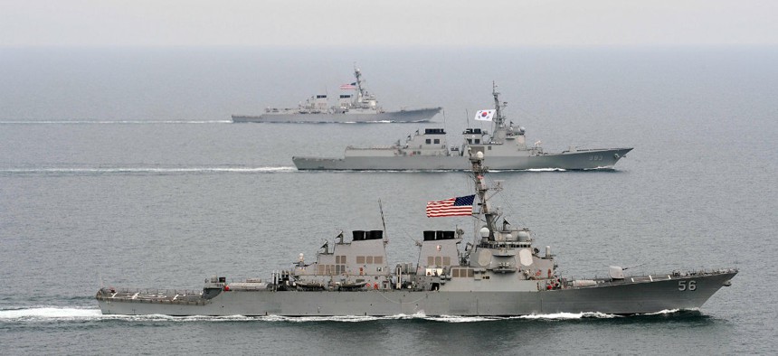 Two U.S. Navy guided missile destroyers flank a Republic of Korea destroyer during an exercise west of the Korean Peninsula.