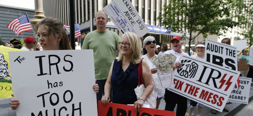 Demonstrators in 2013 protest the Internal Revenue Service's targeting of conservative groups seeking tax-exempt status.