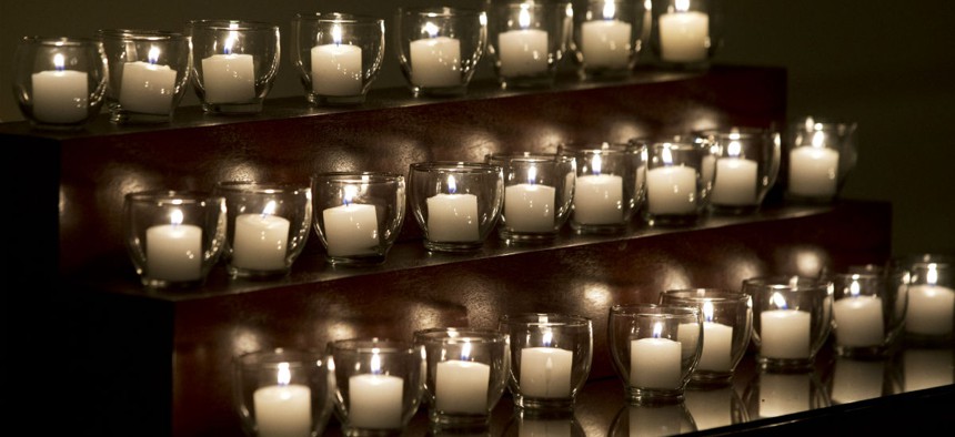 Candles in the White House honor the victims of the Newtown elementary school shooting in December 2012. 
